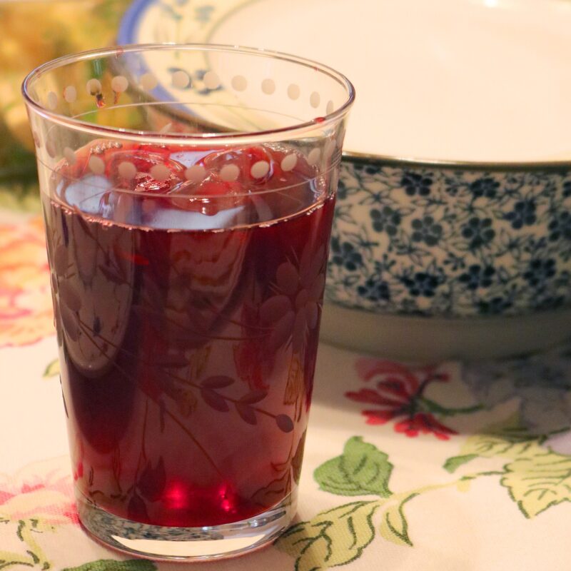 A glass of red sorrel drink